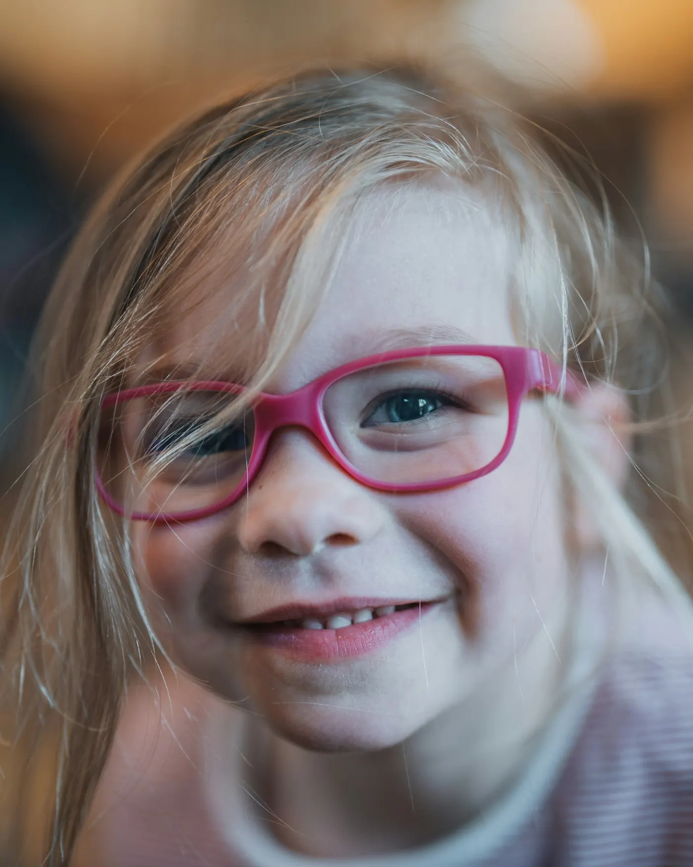 Smiling child wearing glasses